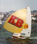 Familiar sight of KB skiff with the gold spinnaker and red KB logo © Frank Quealey