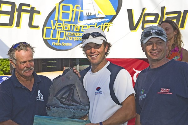 John 'Woody' Winning, Anthony 'Jack' Young and Euan McNicol sailing Computer Associates win the 18ft Skiff Velamare Cup in Palau, Sardinia photo copyright Peter Danby taken at  and featuring the 18ft Skiff class