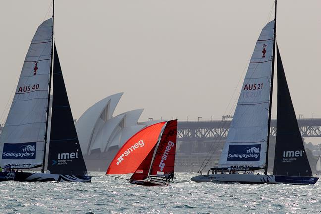 Last week's winner Smeg is dwarfed by two former America's Cup yachts in race 2 of the 18ft Skiff 3-Buoys Challenge - photo © Frank Quealey