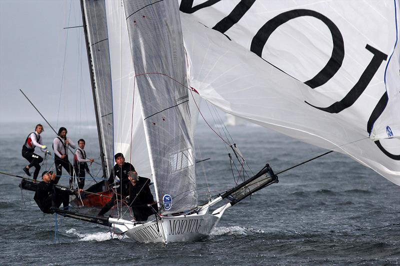 Critical spinnaker drop on a wild Sydney Harbour day photo copyright Frank Quealey taken at  and featuring the 18ft Skiff class