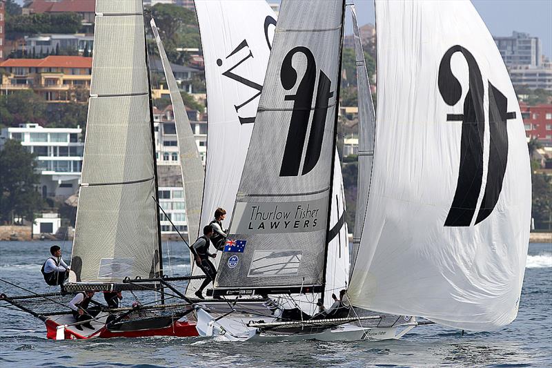 The red hull of Compassmarkets.com grabs the win on the finish line in the Major A. Frizelle Trophy photo copyright Frank Quealey taken at Australian 18 Footers League and featuring the 18ft Skiff class