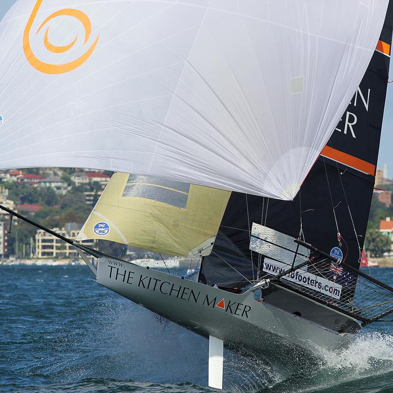 The Kitchen Maker rides the wake made by a passing power boat during  18ft Skiff JJ Giltinan Championship Race 6 photo copyright Frank Quealey taken at Australian 18 Footers League and featuring the 18ft Skiff class