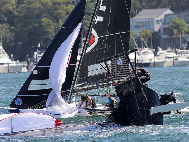 Vintec passes a capsized Rag and Famish Hotel during the 18ft Skiff Queen of the Harbour photo copyright Frank Quealey taken at Australian 18 Footers League and featuring the 18ft Skiff class