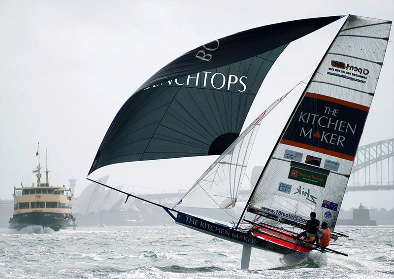 Double gold medal olympian Malcolm Page drives The Kitchen Maker hard downwind photo copyright Frank Quealey taken at Australian 18 Footers League and featuring the 18ft Skiff class