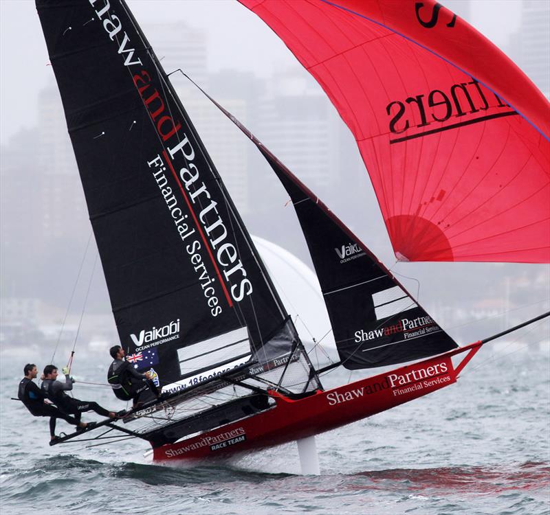 Shaw and Partners Financial Services about to take off on the first spinnaker run during race 1 of the 18ft Skiff Club Championship photo copyright Frank Quealey taken at Australian 18 Footers League and featuring the 18ft Skiff class