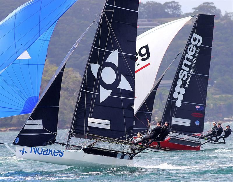 Yvette Heritage drives her Noakes Blue skiff hard in a high speed spinnaker run with Smeg photo copyright Frank Quealey taken at Australian 18 Footers League and featuring the 18ft Skiff class