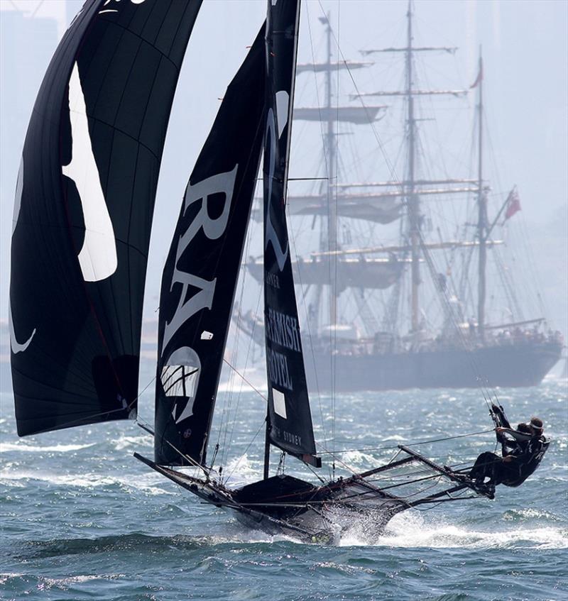 A contrast of old and new on Sydney Harbour as The Rag powers downwind photo copyright Frank Quealey taken at Australian 18 Footers League and featuring the 18ft Skiff class