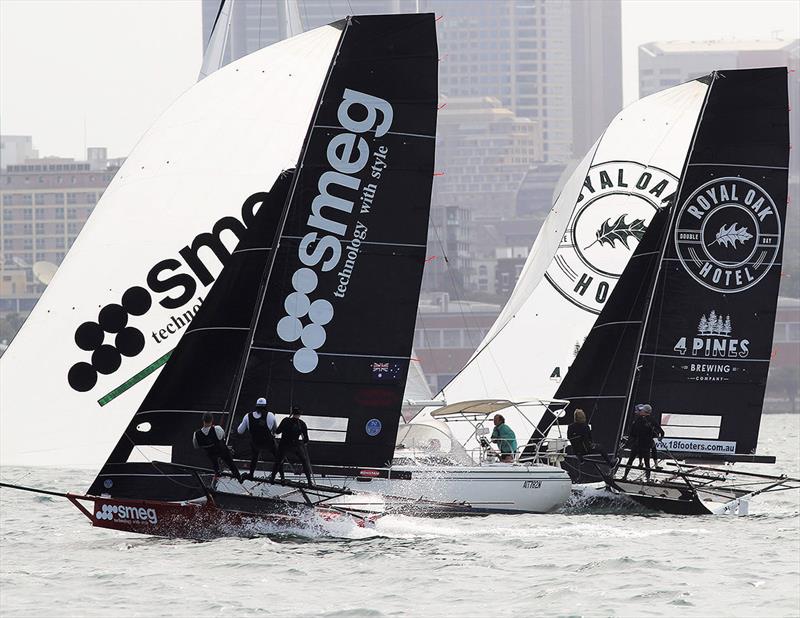 Smeg and The Oak Double Bay-4 Pines thread their way past slower traffic on the run in to the bottom mark off Clark Island - NSW Championship 2019 photo copyright Frank Quealey taken at Australian 18 Footers League and featuring the 18ft Skiff class