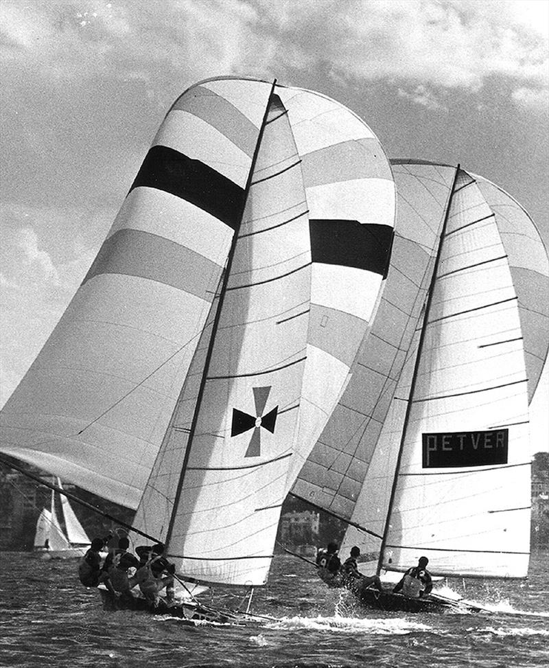 Aussie (maltese cross logo) in typical spinnaker action photo copyright Frank Quealey taken at Australian 18 Footers League and featuring the 18ft Skiff class