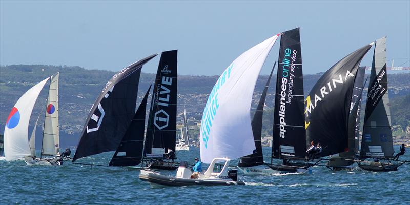 Spinnaker run to Robertson Point during race 15 of the 18ft Skiff Club Championship photo copyright Frank Quealey taken at Australian 18 Footers League and featuring the 18ft Skiff class