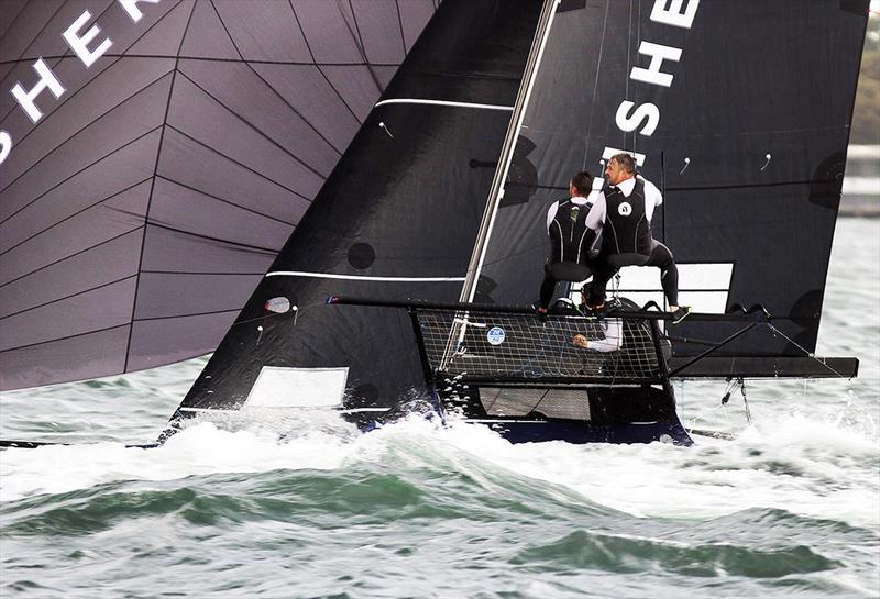 Fisher and Paykel's team had to survive the wake of a power boat which crossed the skiff's bow photo copyright Frank Quealey taken at Australian 18 Footers League and featuring the 18ft Skiff class