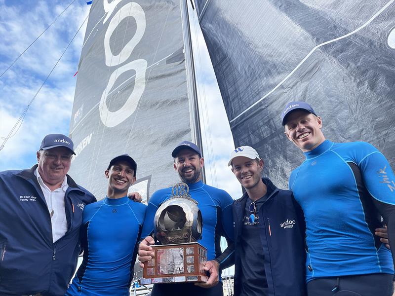 The Andoo team celebrate winning the 2022 JJ Giltinan 18ft Skiff Championship with Iain Murray and John Winning Jr photo copyright Jessica Crisp taken at Australian 18 Footers League and featuring the 18ft Skiff class
