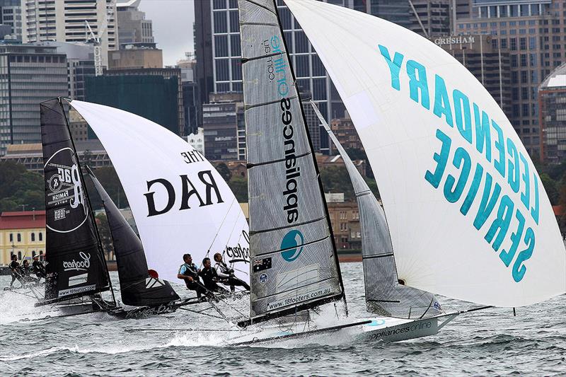 David Witt drives Appliancesonline hard in a tough battle against Rag and Famish Hotel photo copyright Frank Quealey taken at Australian 18 Footers League and featuring the 18ft Skiff class