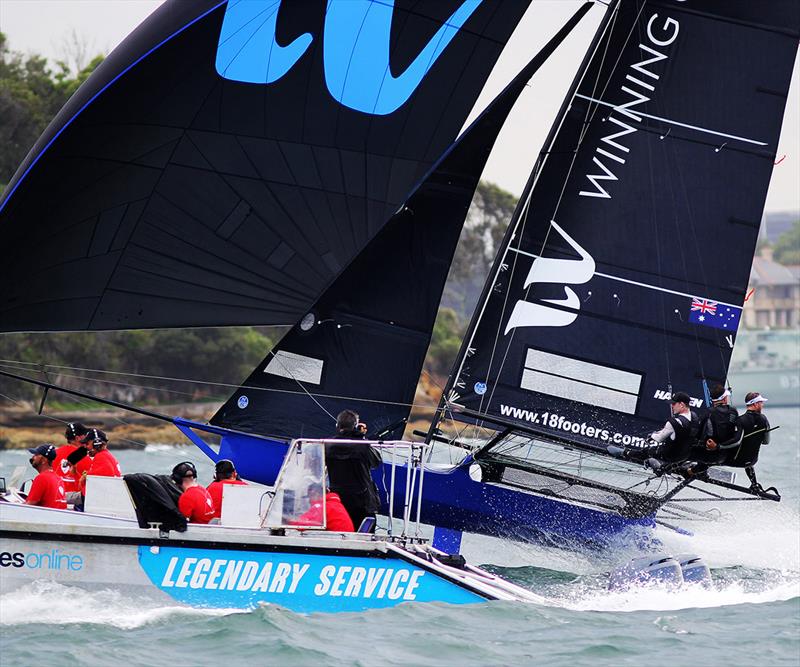 Winning Group skiff races past the Appliances Online-sponsored video Camera Cat in 2019 photo copyright Frank Quealey taken at Australian 18 Footers League and featuring the 18ft Skiff class