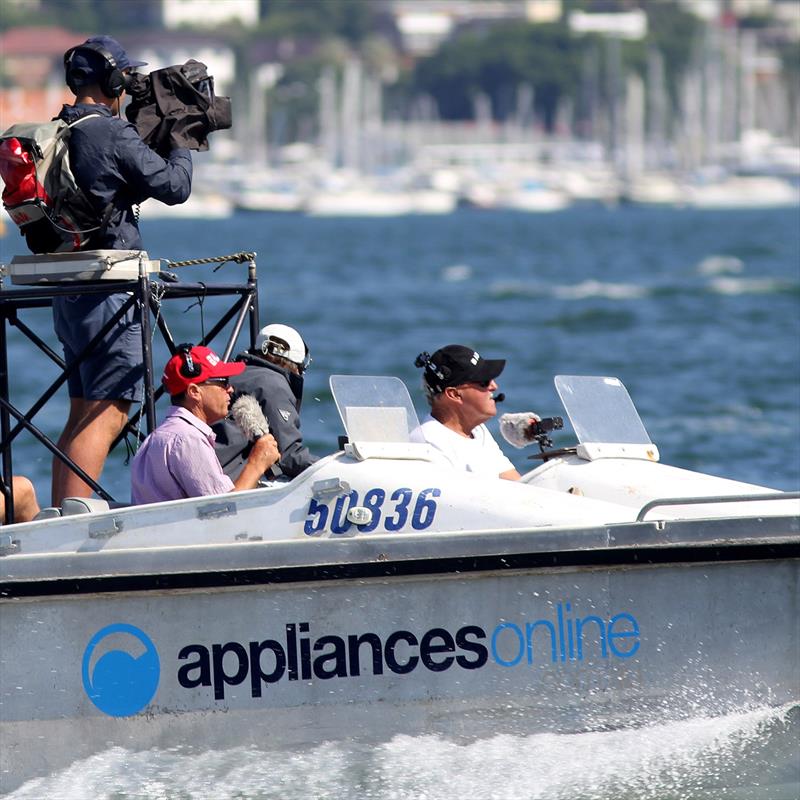 Full concentration by Warwick Rooklyn (red cap) and the commentary team - photo © Frank Quealey