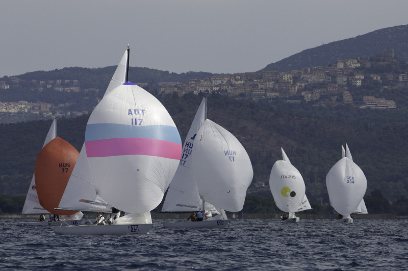 Racing on day two of the Soling worlds at Scarlino, Italy photo copyright James Robinson Taylor / www.jrtphoto.com taken at  and featuring the Soling class