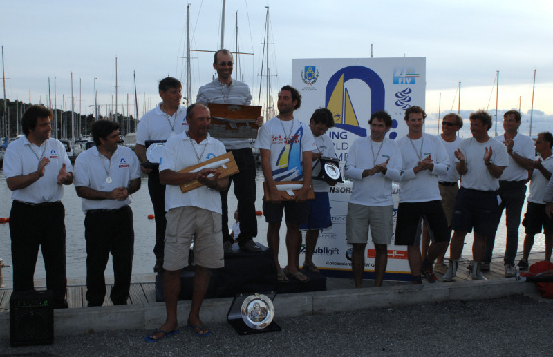 The Slovenian team of Antoncic, Strah & Hmeljak win the Soling worlds at Scarlino, Italy photo copyright James Robinson Taylor / www.jrtphoto.com taken at  and featuring the Soling class
