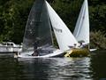 Class winner Nick Titley's Solo (2527) and Ed Cubitt's second-placed Laser at close quarters in the fourth race at at the Minima Regatta 2023, in the background Laser winner Henry Medcalf has his bow just in front © Rob Mayle