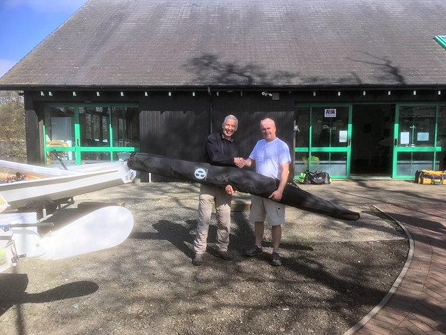 Coast to Coast's Kevan Gibb presenting Nigel Ford with a new sail after the Scottish Solo Traveller at CCC Bardowie photo copyright Hugh McLean taken at Clyde Cruising Club and featuring the Solo class