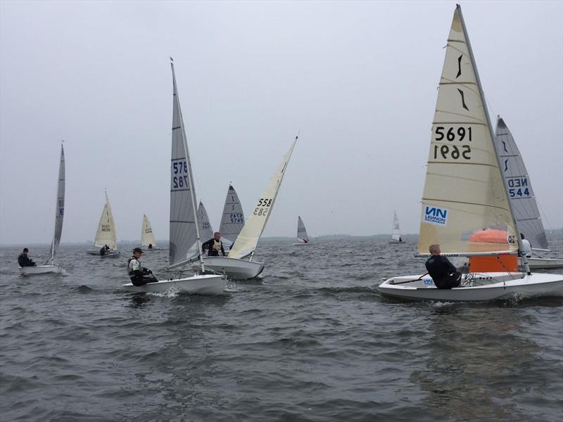 Guy Mayger leads race 5 during the Solo Spring Cup at Medemblik photo copyright Eddy Boon, Robert Wit & Doug Latta taken at Royal Yacht Club Hollandia and featuring the Solo class