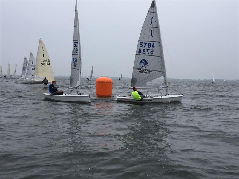 Lawrence Creaser leads Pete Mitchell during the Solo Spring Cup at Medemblik photo copyright Eddy Boon, Robert Wit & Doug Latta taken at Royal Yacht Club Hollandia and featuring the Solo class