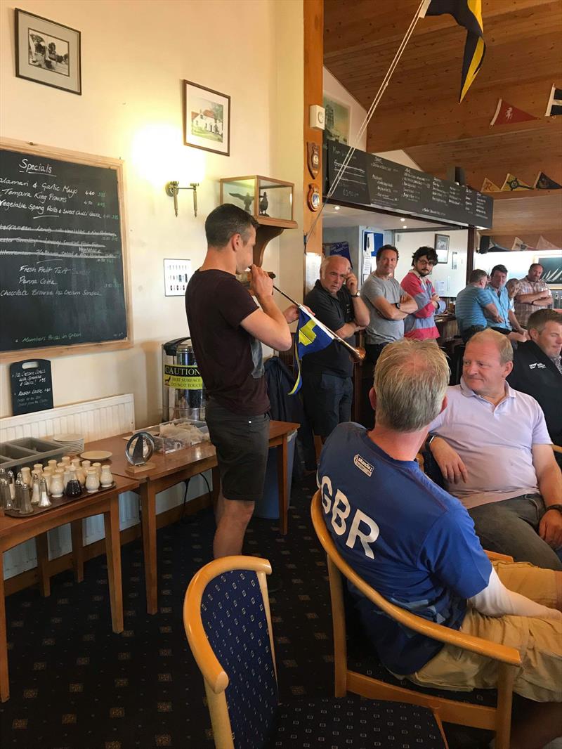 James Boyce blowing his own trumpet at the Portchester Solo Open photo copyright Alex Butler & Guy Mayger taken at Portchester Sailing Club and featuring the Solo class