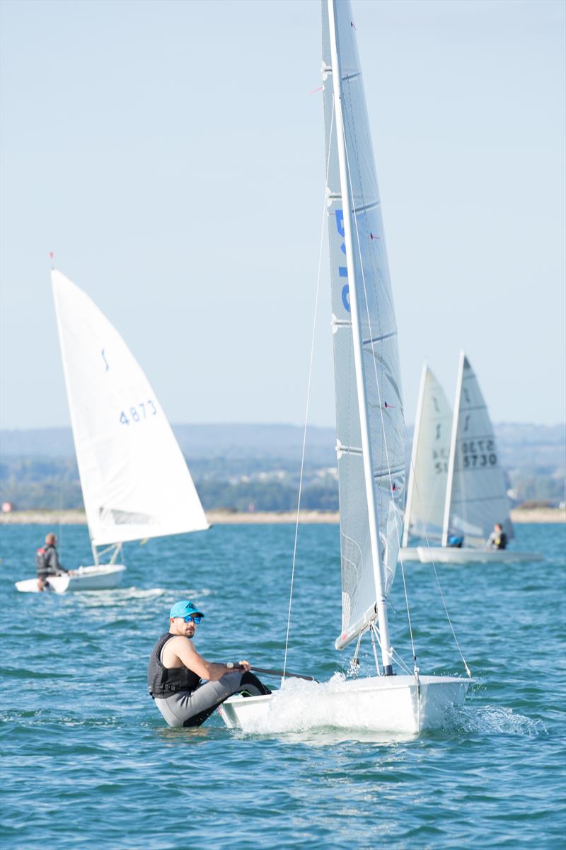 Lawrence 'sun's out, guns out' Creaser during the Mengeham Rythe Solo Open photo copyright Angela Macdonald taken at Mengeham Rythe Sailing Club and featuring the Solo class