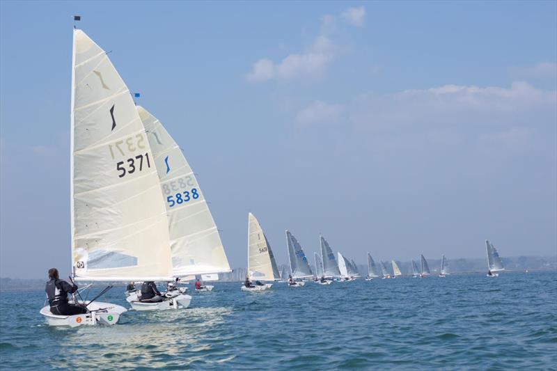 Fleet spread out fighting the tide during the Lymington Solo Open photo copyright Lou Johnson taken at Lymington Town Sailing Club and featuring the Solo class