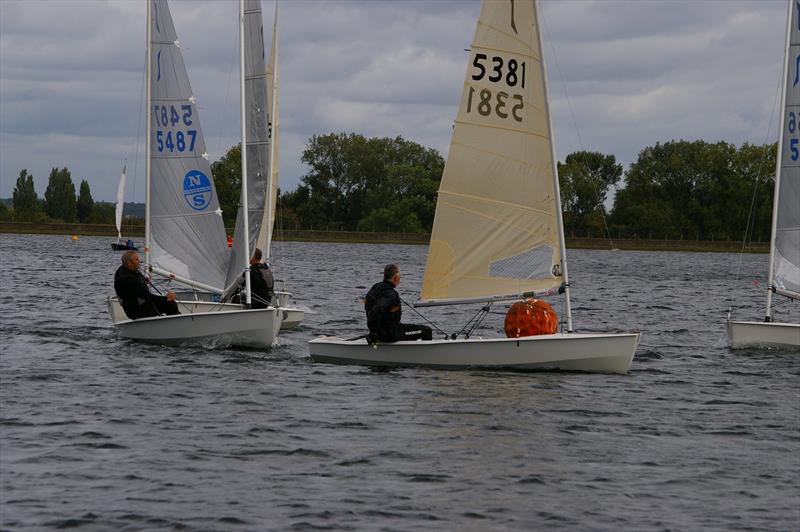 Solos at Island Barn Reservoir photo copyright Jim Champ taken at Island Barn Reservoir Sailing Club and featuring the Solo class