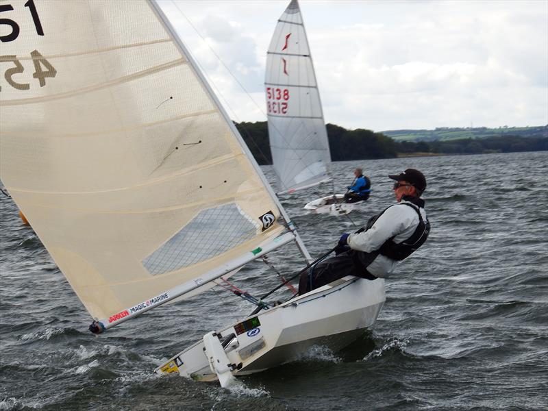 Bill Hutchings hooks into a big lift photo copyright Will Loy taken at King George Sailing Club and featuring the Solo class