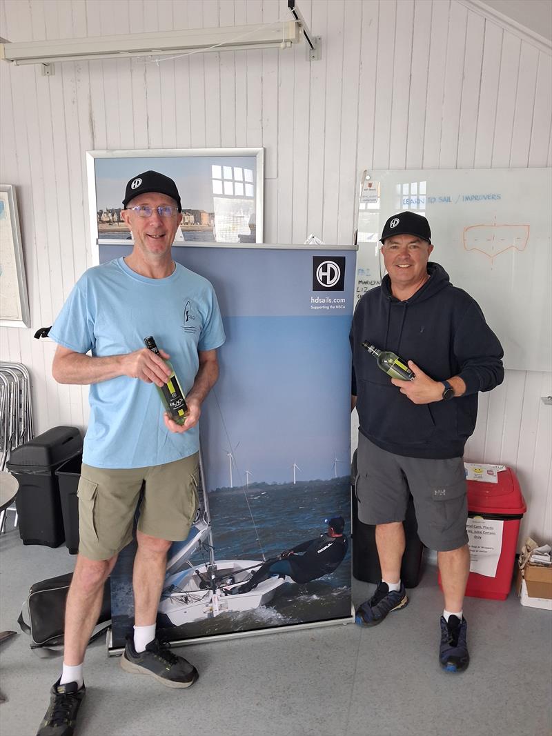 Stuart Gibson and Ross Watson with their bottles of wine at the Scottish Solo Travellers at Royal Tay prize giving photo copyright Charlie Brecknell taken at Royal Tay Yacht Club and featuring the Solo class