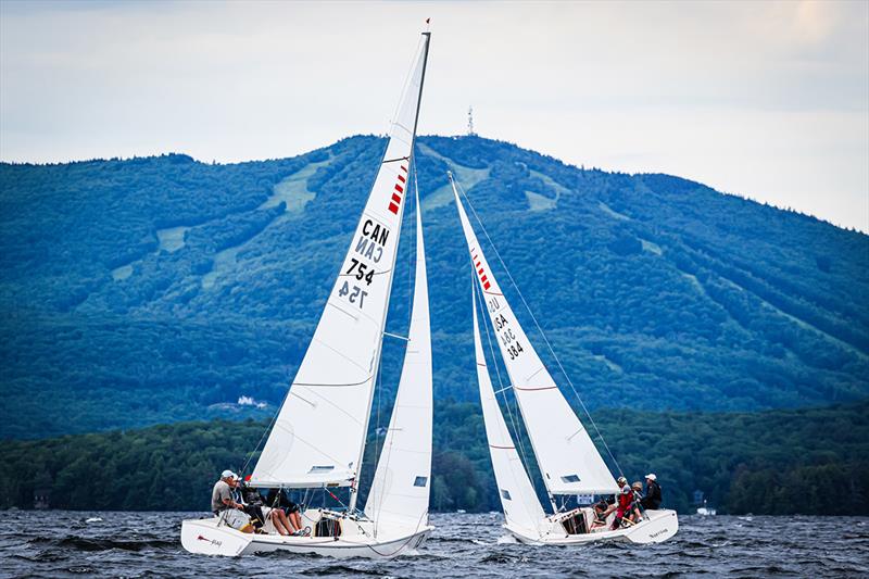 2022 Sonar World Championship - Nefarious and Ping crossing tacks with Mount Sunapee Resort looming ahead photo copyright John Quackenboss taken at Lake Sunapee Yacht Club and featuring the Sonar class