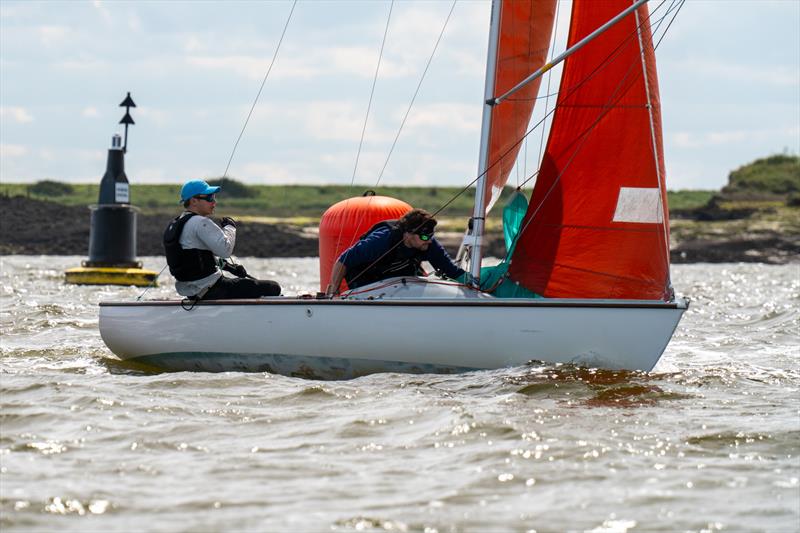 Royal Corinthian Yacht Club Otter Nathan Flynn, helming for Ian Simons, on Cheque Mate 157, downwind leg during the 28th edition of the Squib Gold Cup at Royal Corinthian Yacht Club photo copyright Petru Balau Sports Photography / sports.hub47.com taken at Royal Corinthian Yacht Club, Burnham and featuring the Squib class