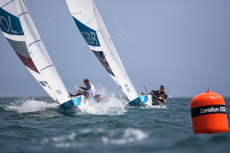 Star racing on day five of the London 2012 Olympic Sailing Competition photo copyright Tom Gruitt / www.tom-gruitt.co.uk taken at Weymouth & Portland Sailing Academy and featuring the Star class