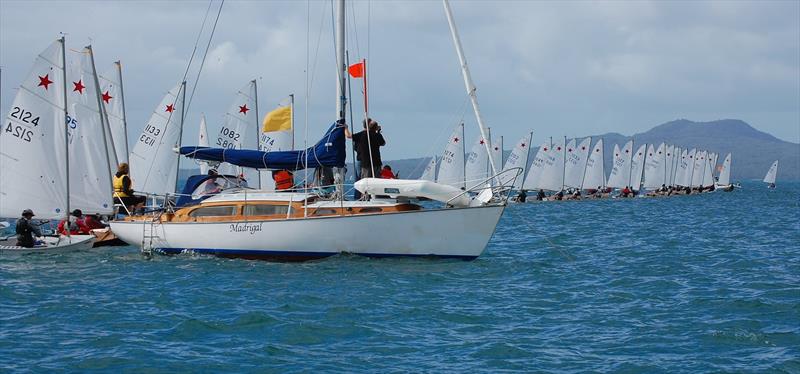 A big Townson starting the flock of little ones. Race Officer Richard Brown's Townson 32 Madrigal as start boat for the 2012 Nationals. - photo © Brian Peet