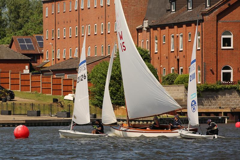 Graham Sexton & Alan Gillard separated by a Waveney One Design during the Waveney & Oulton Broad Streaker Open photo copyright Karen Langston taken at Waveney & Oulton Broad Yacht Club and featuring the Streaker class