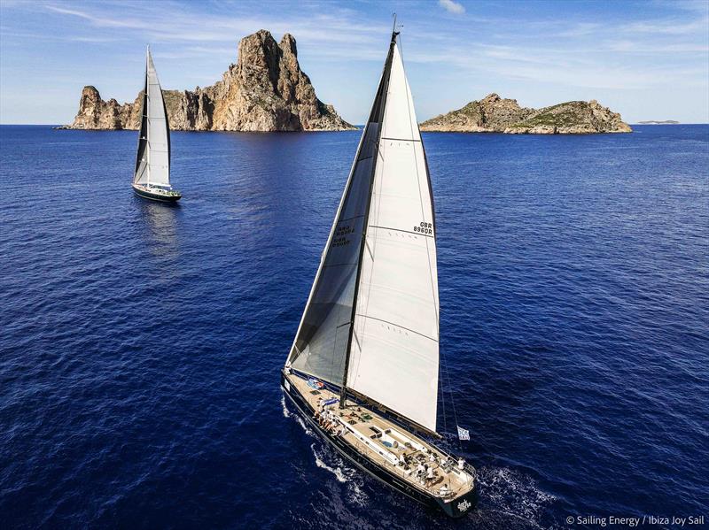 Ibiza JoySail Day 2: Black Horse and Scorpion of London with the islet of Es Vedrà in the background - photo © Sailing Energy
