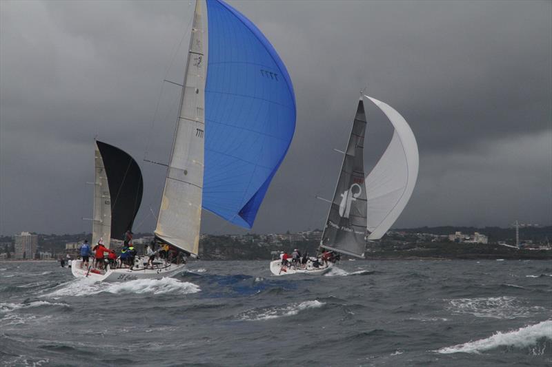 Hard downwind as rain approaches on day 1 of the Sydney 38 OD International Championship - photo © Tim Vine / Yoti