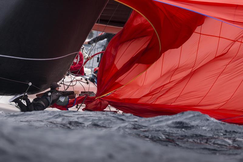 Conspiracy bowman is saved by the lifelines on day 1 of the Sydney Harbour Regatta photo copyright Andrea Francolini taken at Middle Harbour Yacht Club and featuring the Sydney 38 class