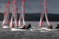 Competitors racing in between rain squalls on Race Day 1 at the NSW Tasar States 2022 © Sail Port Stephens / @sailorgirlHQ