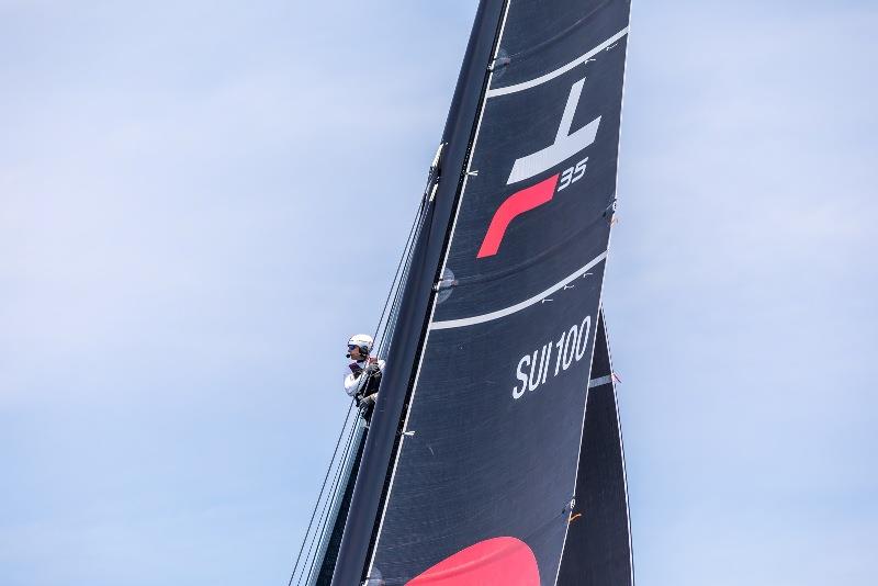 Tactician in the air to get a better view on the wind spots photo copyright Jeanmi Photographies taken at Société Nautique de Genève and featuring the TF35 class