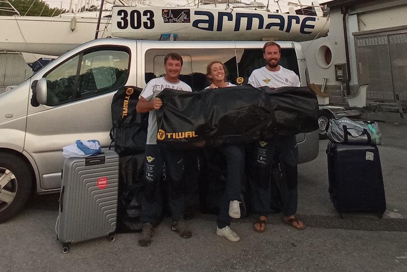 Franco Deganutti, Elisabetta Maffei, Manuel Vlacich with one of the 4 bags containing the boats, the day before departure for The World's Highest Match Race photo copyright The Grand Tour taken at  and featuring the Tiwal 3R class