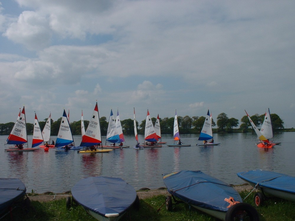 A beautiful summers day but very light variable winds at the Doddington Mere Topper open photo copyright Brian Rouse taken at Nantwich & Border Counties Sailing Club and featuring the Topper class