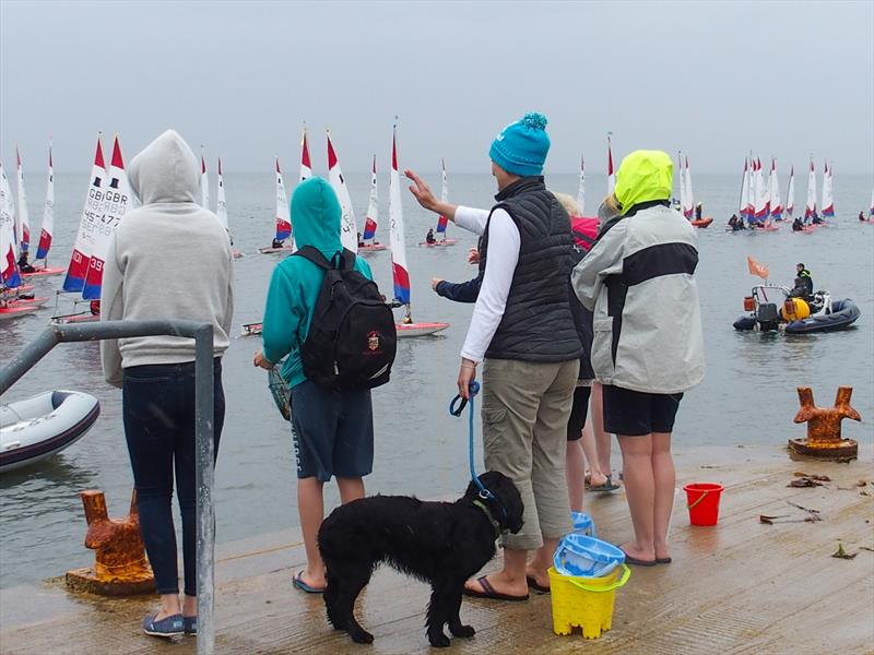 Supporters wave to the Toppers as they sail to the race area during the Topper Nationals at East Lothian photo copyright Derek Braid taken at East Lothian Yacht Club and featuring the Topper class