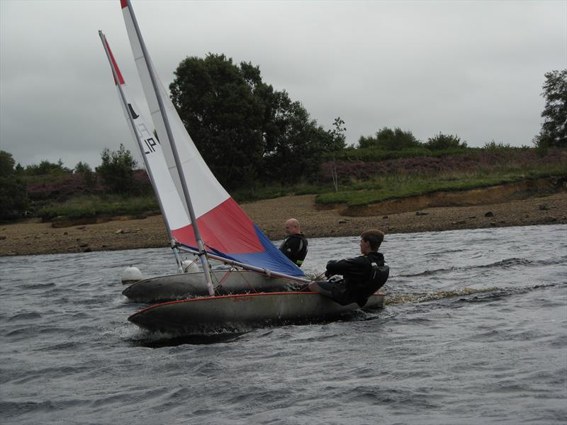 Archie Dodd and Dave Watt on the final straight during the August Bank Holiday weekend at Kielder Water photo copyright Annabelle Scullion taken at Kielder Water Sailing Club and featuring the Topper class
