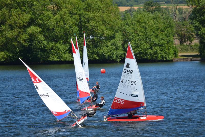 Merryn Attridge up with the big guns during Topper Midlands Traveller Round 4 at Swarkestone photo copyright Victoria Turnbull taken at Swarkestone Sailing Club and featuring the Topper class