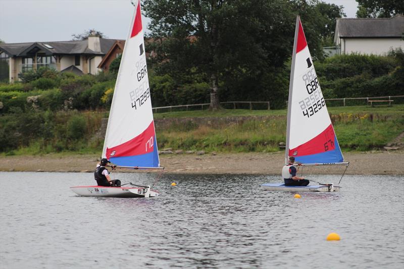 Hollingworth Lake Junior Regatta Week - Lightweight Jasper gets ahead of Stuart photo copyright Rhiann Bramwell taken at Hollingworth Lake Sailing Club and featuring the Topper class