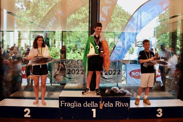 4.2 podium in the Topper Worlds 2022 at Lake Garda photo copyright James Harle, Alex Dean, Mauro Melandri taken at Fraglia Vela Riva and featuring the Topper 4.2 class