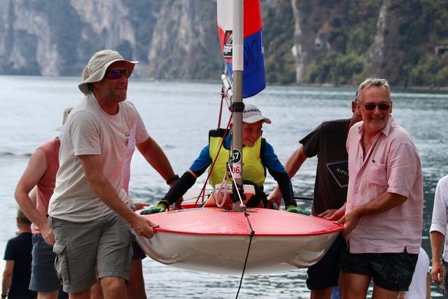 Calum Pollard Comes ashore as 4.2 winner in the Topper Worlds 2022 at Lake Garda photo copyright James Harle, Alex Dean, Mauro Melandri taken at Fraglia Vela Riva and featuring the Topper 4.2 class