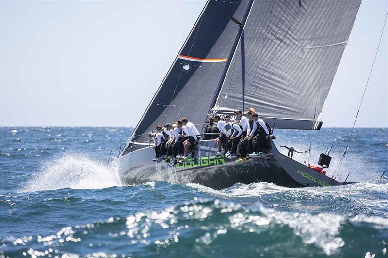 Marcus Blackmore's TP52 Hooligan heading out of Sydney Heads towards an IRC Div1 victory - 2018 CYCA Trophy Series photo copyright Hamish Hardy taken at Cruising Yacht Club of Australia and featuring the TP52 class